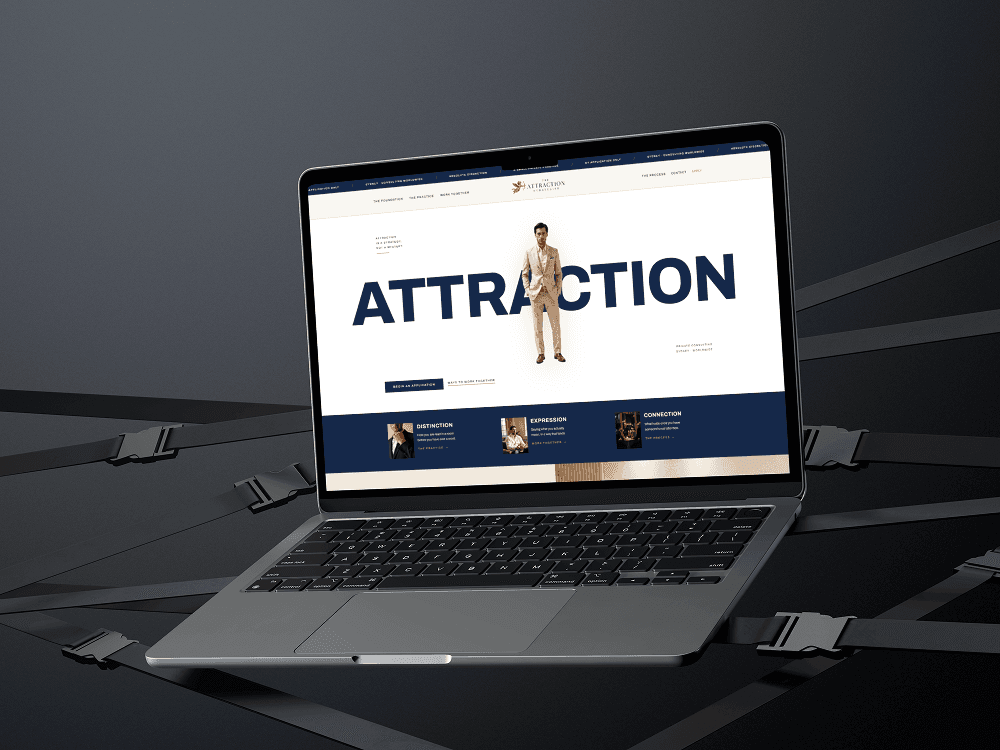 The Attraction Strategist website shown on a laptop