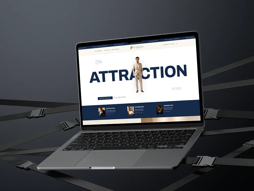 The Attraction Strategist website shown on a laptop